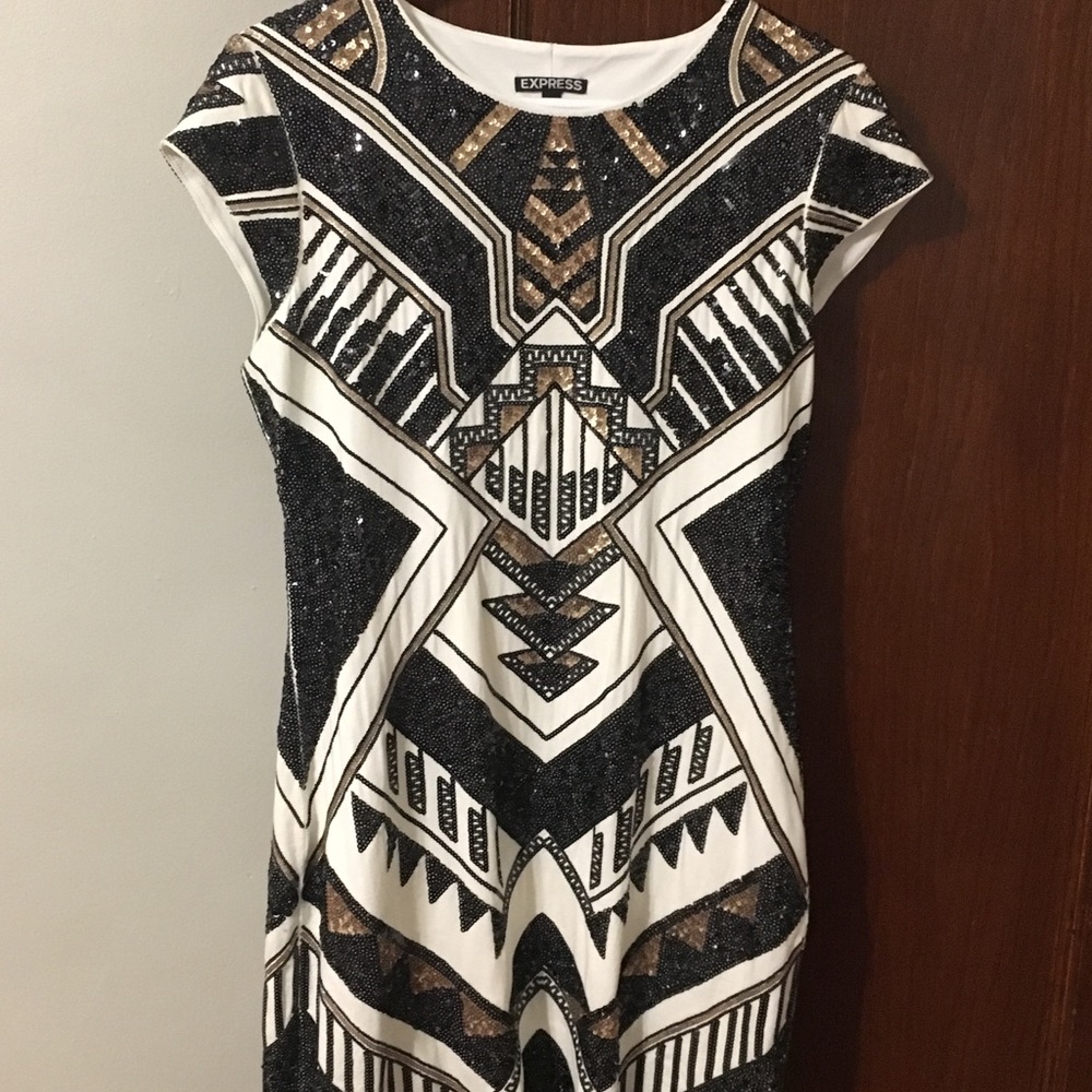 Black and gold sequin dress.